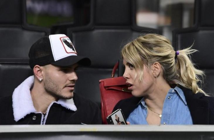 Mauro Icardi dan istrinya, Wanda Nara saat menyaksikan laga Inter Milan vs Rapid Wien di leg kedua Liga Europa pada 21 Februari 2019 (Migeul Medina/AFP)