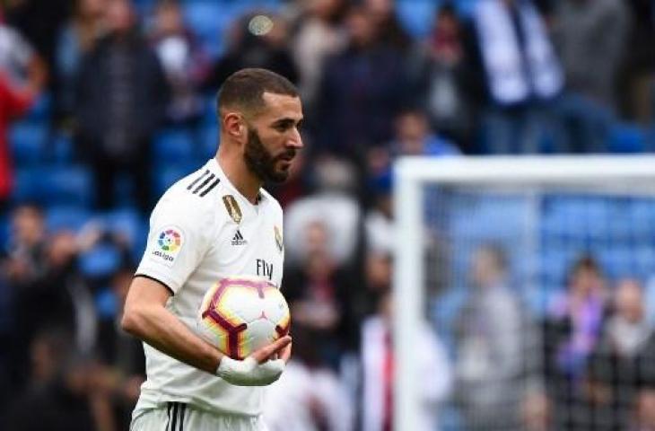 Karim Benzema menjadi pahlawan Real Madrid kala mengalahkan Athletic Bilbao tiga gol tanpa balas dalam lanjutan La Liga Spanyol, Minggu (21/4/2019) malam WIB. (GABRIEL BOUYS / AFP)