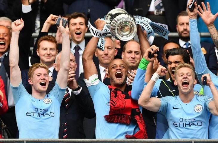 Manchester City juara Piala FA usai kalahkan Watford di partai final dengan skor 6-0, Sabtu (18/5/20190. The Citizens cetak rekor tim Inggris pertama yang raih treble winner selama semusim. [Daniel LEAL-OLIVAS / AFP]