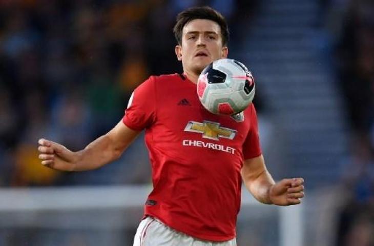 Aksi bek Manchester United, Harry Maguire saat melawan Wolverhampton Wanderers pada Selasa (20/8/2019) dinihari WIB. (PAUL ELLIS / AFP)