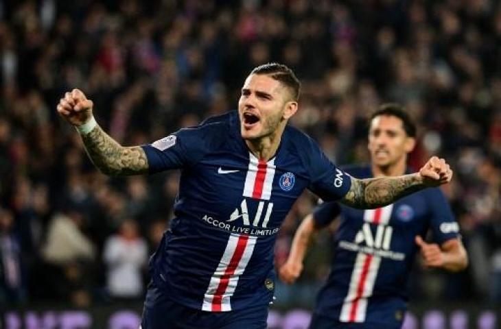 Penyerang PSG, Mauro Icardi melakukan selebrasi usai menjebol gawang Marseille. (MARTIN BUREAU / AFP)