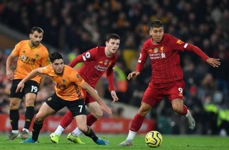 Aksi para pemain Liverpool saat mengalahkan Wolverhampton Wanderers 1-0 pada pekan ke-20 Liga Primer Inggris. (PAUL ELLIS / AFP)