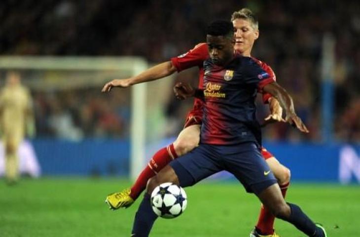 Penampilan Alex Song saat berseragam Barcelona. (LLUIS GENE / AFP)