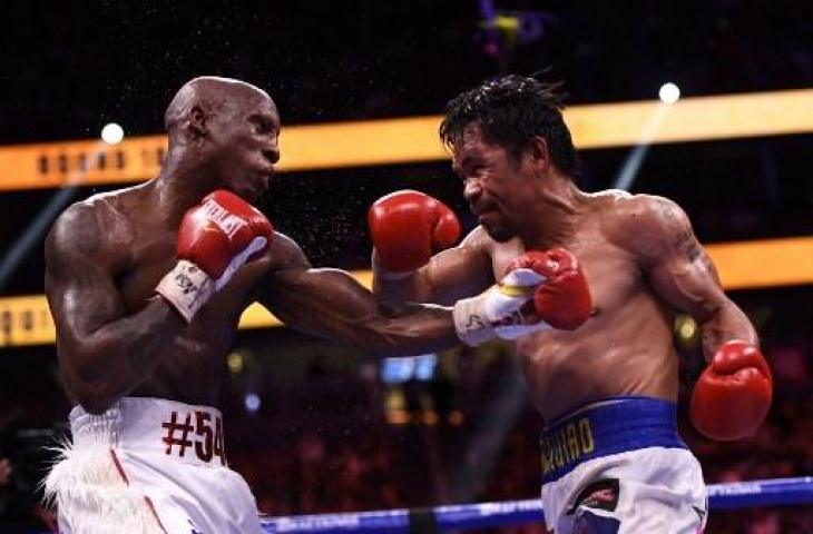 Pertarungan Manny Pacquiao melawan Yordenis Ugas. (PATRICK T. FALLON / AFP)