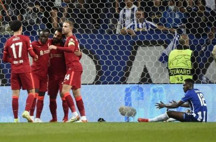 Penyerang Liverpool, Mohamed salah berselebrasi usai bobol gawang Porto di Liga Champions. (MIGUEL RIOPA / AFP)