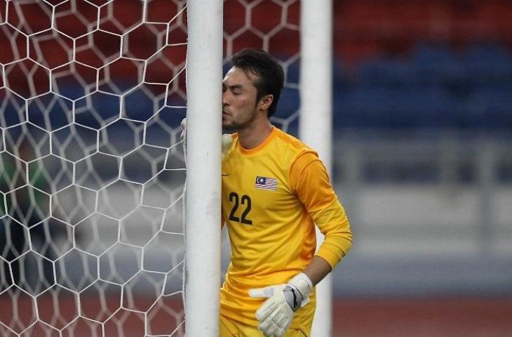 Kiper Malaysia Khairul Fahmi Ce Mat di Piala AFF 2021. (AFP/Mohd Rasfan)