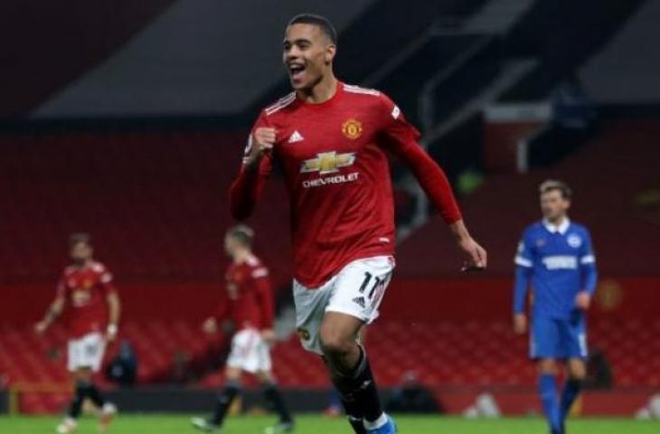 Penyerang Manchester United, Mason Greenwood merayakan golnya ke gawang Brighton pada laga Liga Inggris 2020/2021 di Old Trafford, Manchester, Senin (5/4/2021). [Twitter]