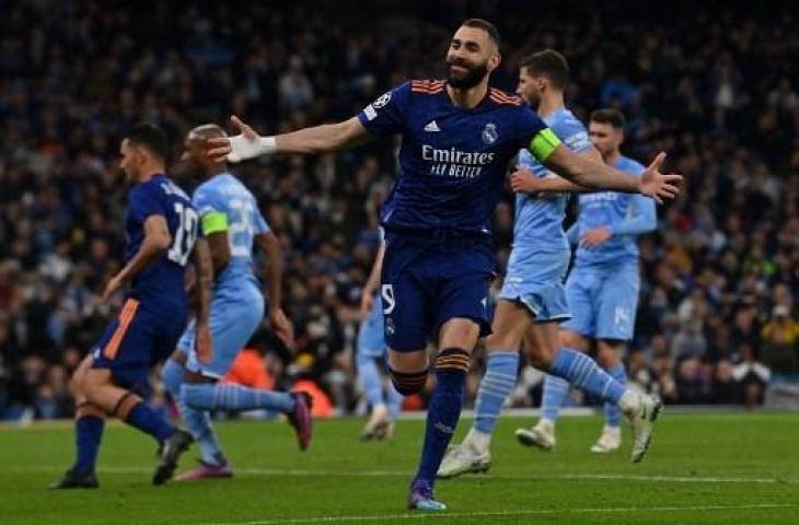 Karim Benzema usai mencetak gol ke gawang Manchester City pada leg pertama semifinal Liga Champions. (Paul Ellis/AFP)