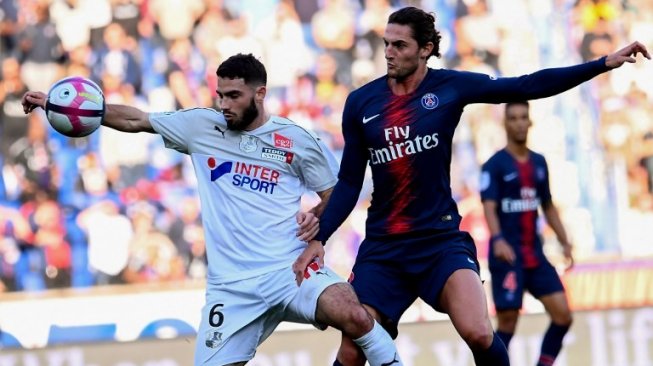 Gelandang sentral Paris Saint-Germain, Adrien Rabiot (kanan). [Anne-Christine POUJOULAT / AFP]