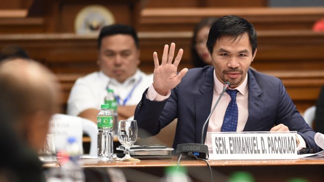 Ikon tinju dunia yang juga senator Filipina, Manny Pacquiao. [AFP/Ted Aljibe]