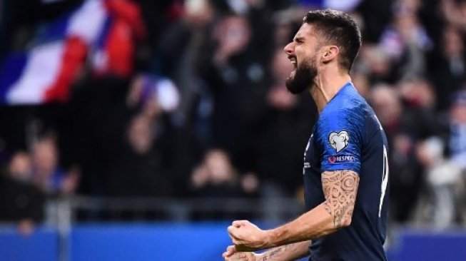 Striker Prancis Olivier Giroud merayakan golnya ke gawang Moldova saat lanjutan Grup H Kualifikasi Piala Eropa 2020 di Stade de France in Saint-Denis. FRANCK FIFE / AFP