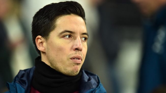 Mantan pemain Arsenal, Manchester City dan West Ham United, Samir Nasri. [GLYN KIRK / AFP]